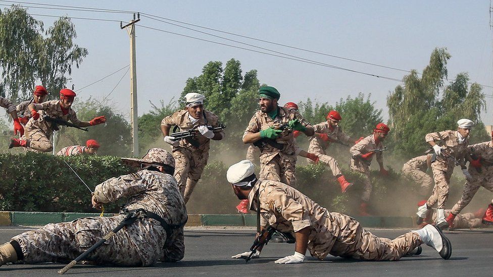 Soldiers run for cover during the attack