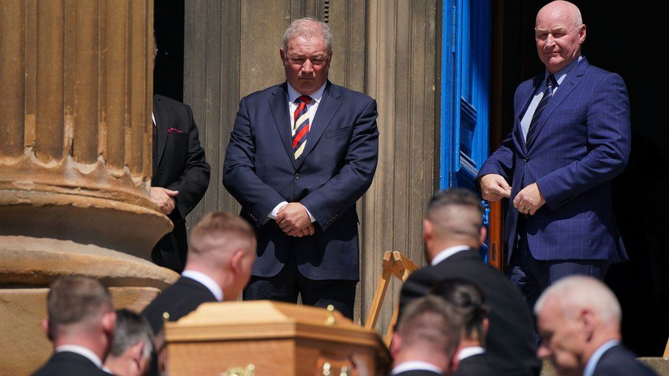 Former team-mates Ally McCoist and John Brown watched on as Andy Goram's coffin was carried into church