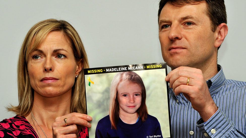 Gerry and Kate McCann whose daughter Madeleine disappeared from a holiday flat in Portugal in 2007 at a press conference in London where they hold an image of what Madeline might look like as an older girl. A German prisoner has been identified as a suspect in the disappearance of Madeleine, detectives have revealed.