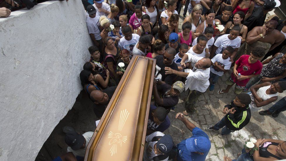 Coffin carried to funeral service in Rio de Janeiro. 30 Sept 2015