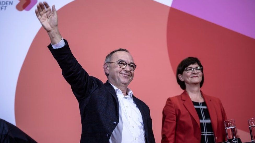 Norbert Walter-Borjans and Saskia Esken celebrate winning the SPD race
