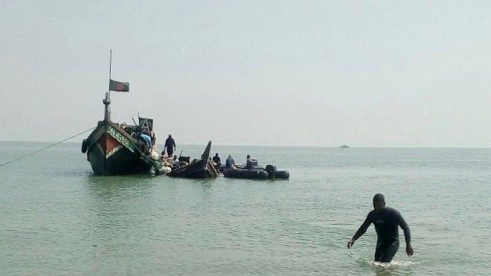 The boat being pulled ashore