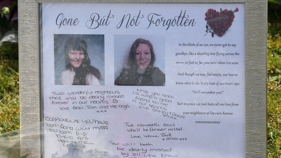 Tribute left outside the home of Elizabeth and Katie Edwards after their murder