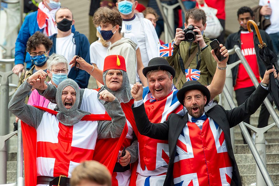 England fans arrive in costumes at Wembley Stadium ahead of the England v Denmark UEFA Euro 2020 semi-final