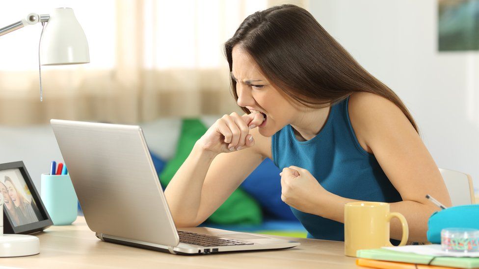 Angry woman on laptop