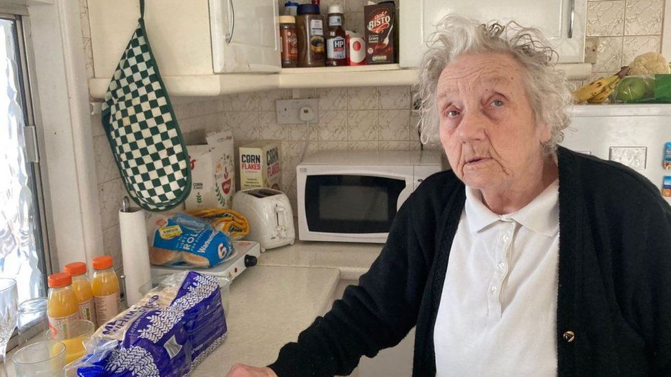 A pensioner in her kitchen
