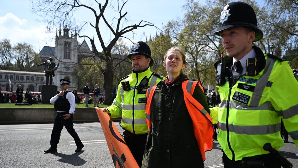 Police arrest a Just Stop Oil protester during a demonstration in central London on 3 May