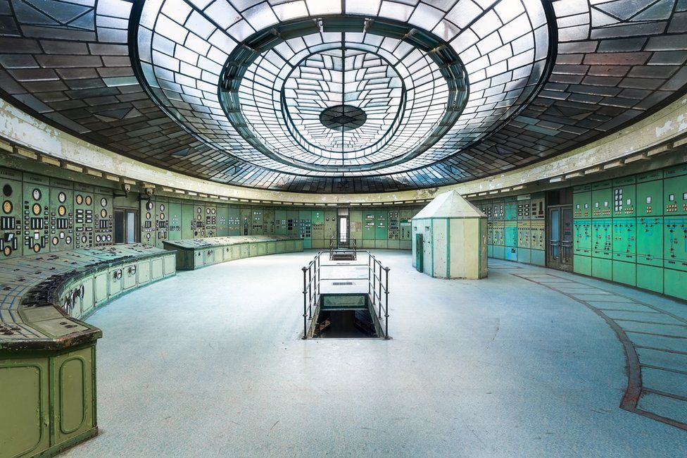 A control room in a power station with a glass-panelled ceiling