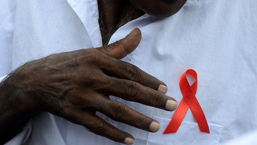 A man wears an Aids awareness ribbon during a rally in Sri Lanka (December 2015)