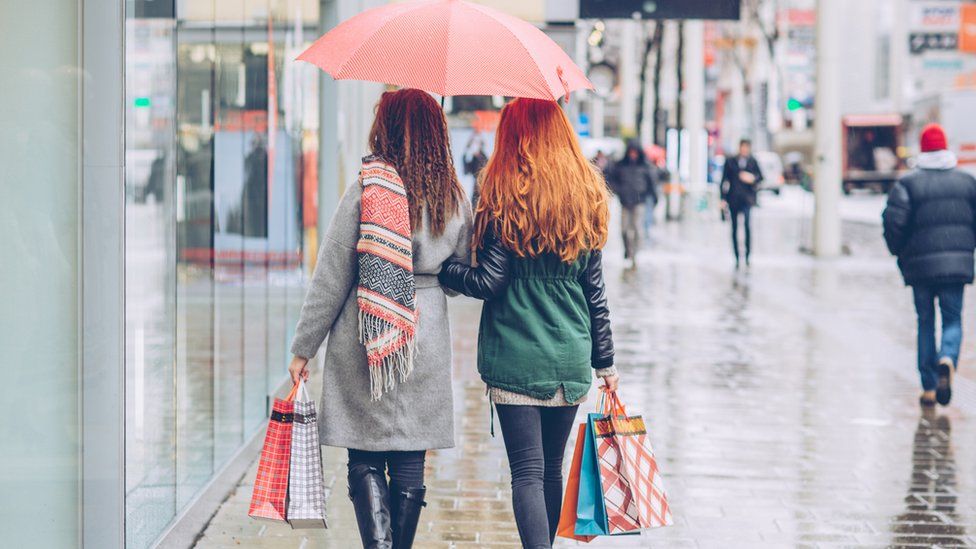 Shoppers in the rain