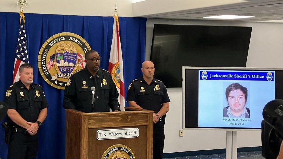 The photograph of Ryan Christopher Palmeter, 21, is shown at a news conference in Jacksonville