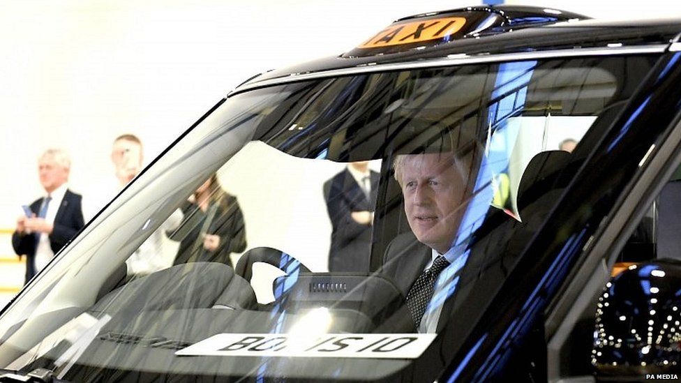 Boris Johnson at the wheel of a new electric taxi manufactured in Coventry