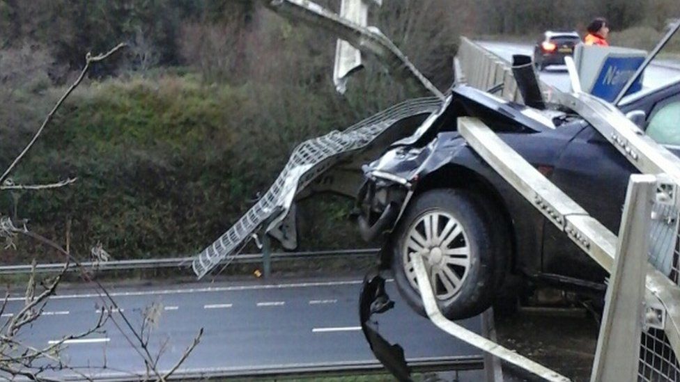 Car on bridge crashed through barrier