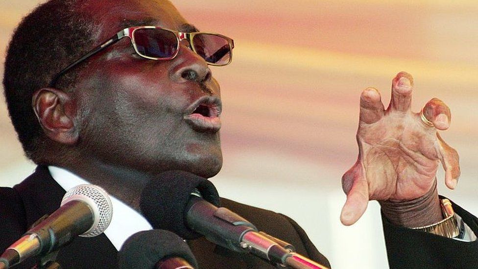 Robert Mugabe speaks during the funeral of a stalwart of the ruling ZANU-PF party at the National Heroes Acre in Harare on June 7, 2014