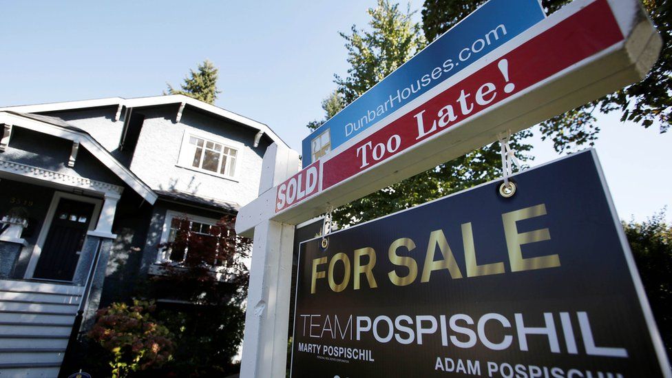 A real estate for sale sign is pictured in front of a home in Vancouver, British Columbia, Canada, September 22, 2016