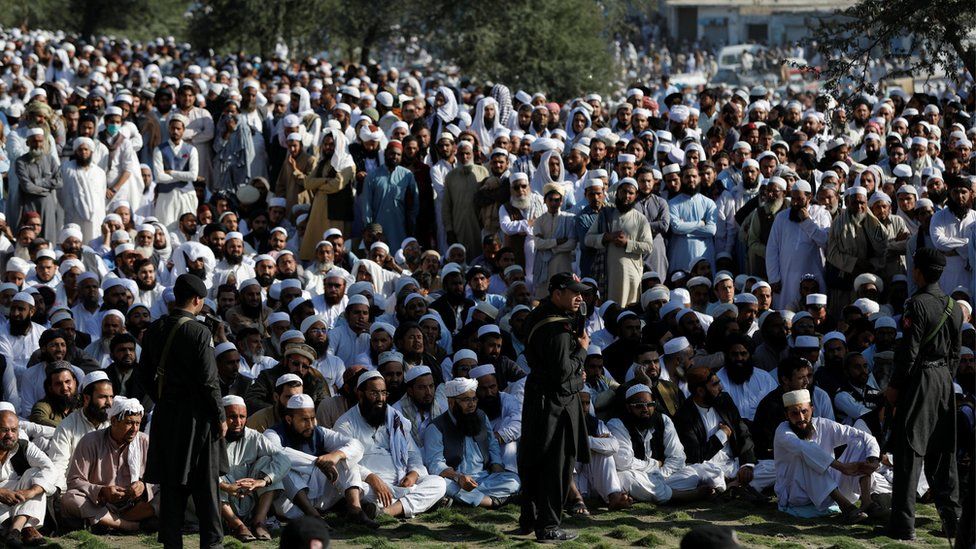 Soldiers stand guard as people gather at a funeral of Muslim cleric Sami ul-Haq in Akora Khattak, Pakistan, 3 November 2018