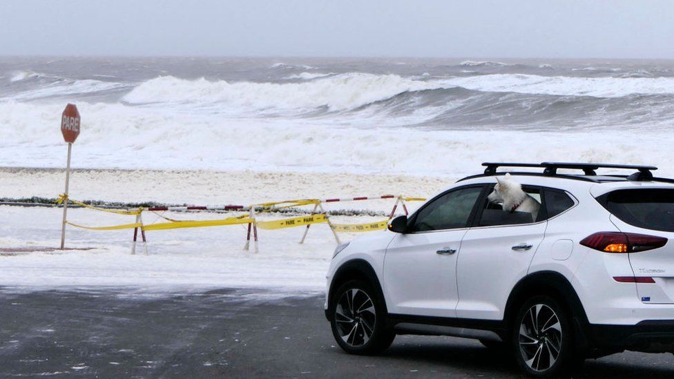 Foam and sea spray cover the sea front promenade during the passage of a subtropical cyclone in Punta del Este, Uruguay, on May 17, 2022.