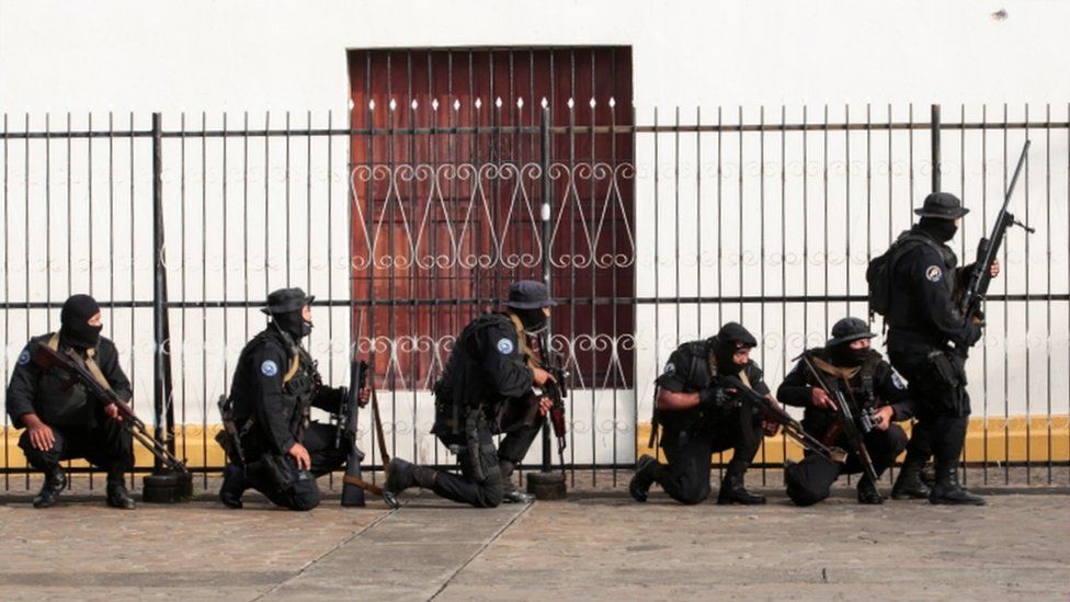 Members of Nicaragua's Special Forces are seen next to a church during clashes with anti-government protesters in the indigenous community of Monimbo in Masaya, 14 July 2018
