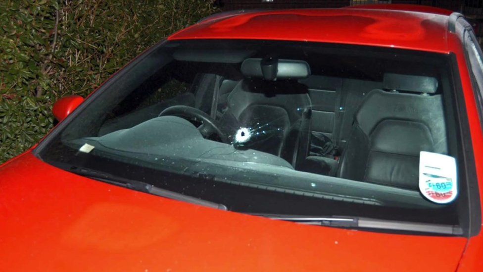 Bullet hole in car windscreen