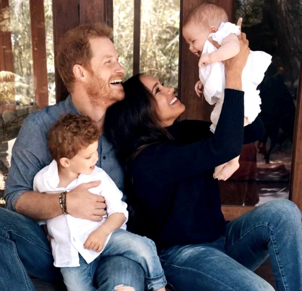 Image from 2021 holiday card from Duke and Duchess of Sussex showing the couple with their children Archie and Lilibet