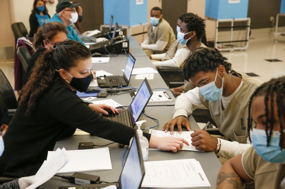 Men in Cook County Jail check in before casting their votes after a polling place was opened in the facility for early voting on 17 October, 2020