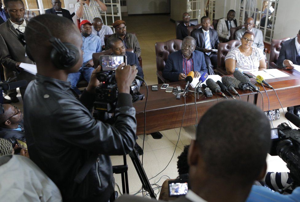 Morgan Tsvangirai (C), leader of the MDC (Movement for Democratic Change) addresses the media during a press conference, Harare, 16 November 2017. Tsvangirai called for President Mugabe to step down and a democratic process to be implemented to choose a new Zimbabwe leader. This comes days after the Zimbabwe military took to the streest and confined President Robert Mugabe to his home.