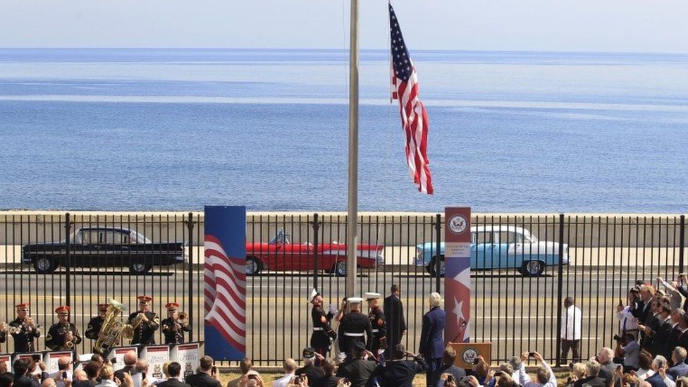 US marines raise the US flag while watched over by US Secretary of State John Kerry (C, at lectern, back to camera) at the US embassy in Havana, Cuba, August 14, 2015