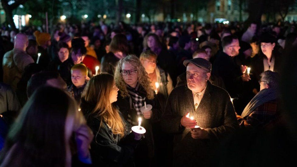 People attend a candlelit vigil for murdered 16-year-old Brianna Ghey at Sackville Gardens in Manchester.