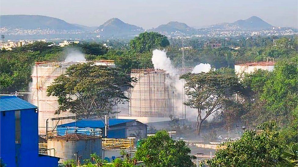 Smokes rise from an LG Polymers plant following a gas leak incident in Visakhapatnam on May 7, 2020. -