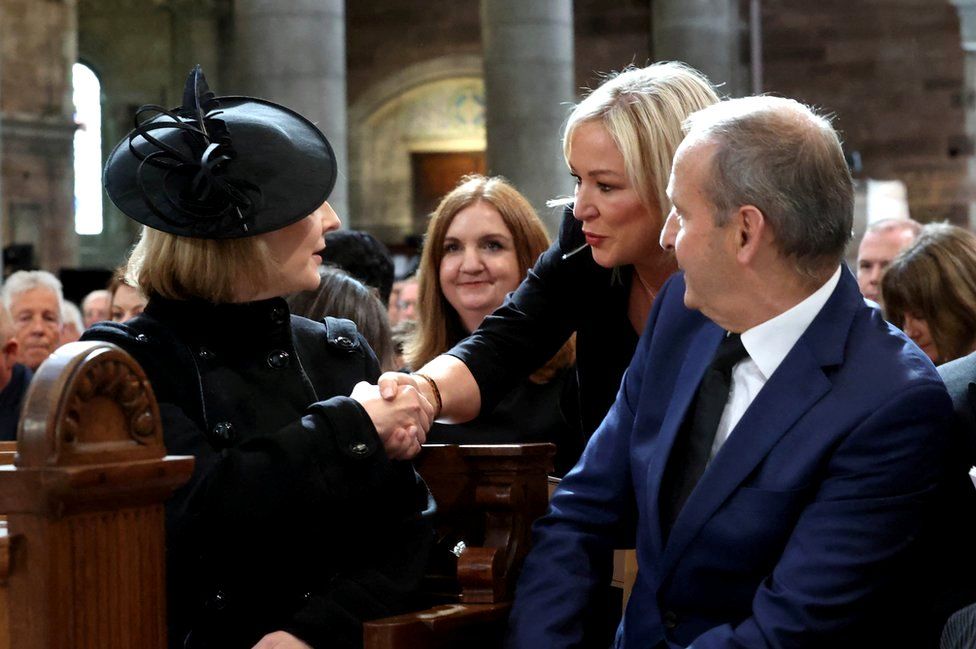 Prime Minister Liz Truss and Sinn Féin vice-president Michelle O'Neill shake hands as Taoiseach Micheál Martin looks on