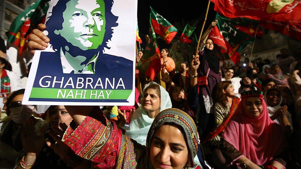 Supporters of Imran Khan shout slogans during a rally in Karachi