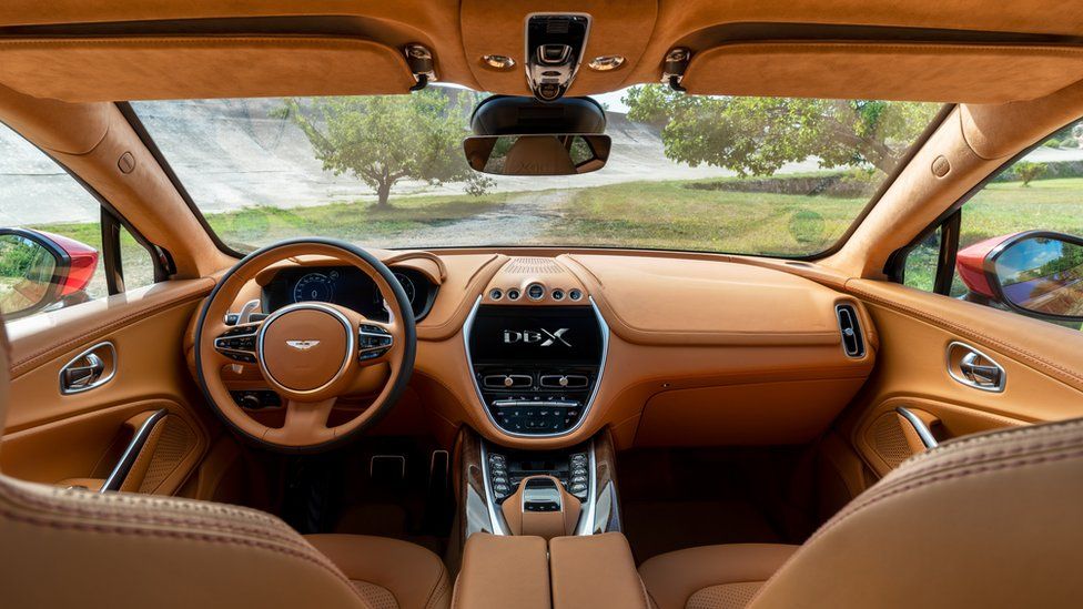 The interior of the Aston Martin DBX with the wheel on the left