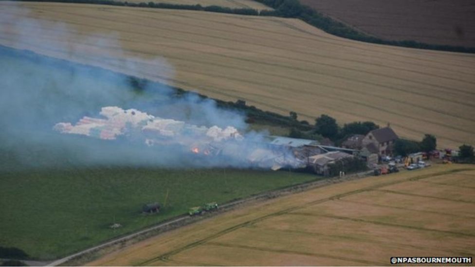 Pilot spots Dorset farm fire from the air BBC News