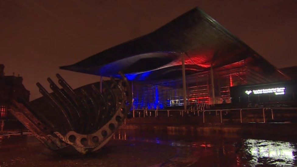The Senedd lit up with the tricolour