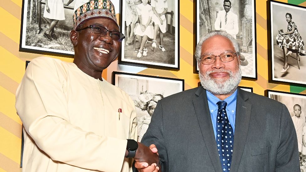 Dr Abba Isa Tijani, Nigerian professor of museology and anthropology, shakes hands with Lonnie G Bunch III, secretary of the Smithsonian Institution, at the Benin Bronzes repatriation ceremony and reception at the National Museum of African Art on 11 October 2022 in Washington DC, the US