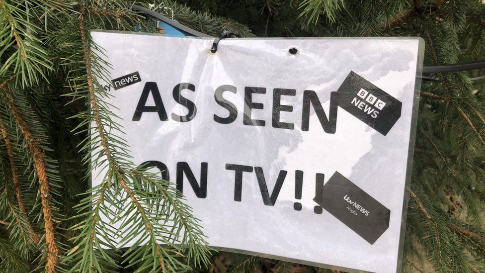 A sign reading 'as seen on TV' has been put in the branches