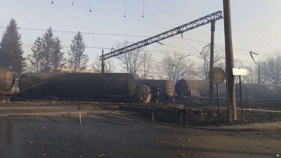 In this photo released by Bulgarian Interior Ministry, burned containers are seen derailed after an explosion upon derailment in the village of Hitrino in Bulgaria Saturday, Dec 10, 2016.