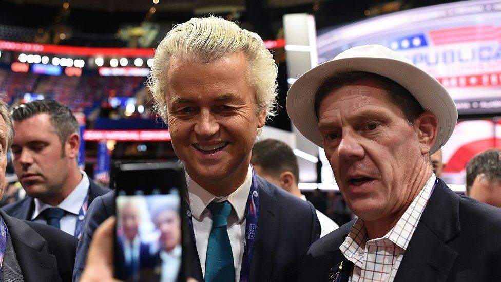 Dutch politician Geert Wilders poses for a photograph with an unidentified man on the convention floor before the start of the second day of the Republican National Convention, at which Donald Trump was confirmed as the Republican candidate, on 19 July 2016 in Cleveland, Ohio