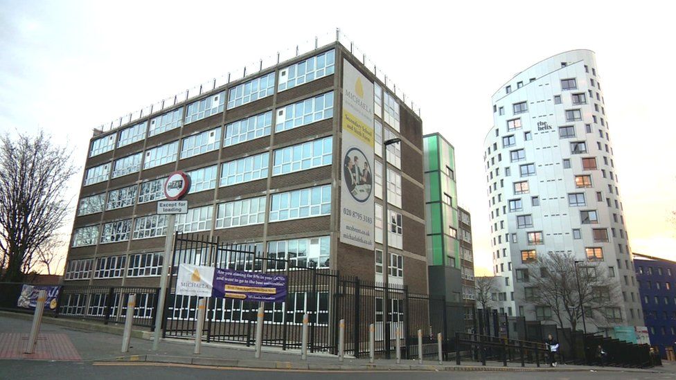 Images showing the brick and glass school building with signs and banners advertising it