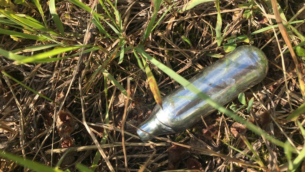 Nitrous gas canister in grass