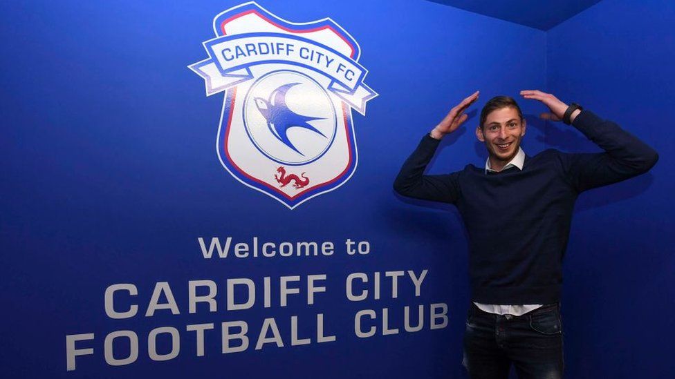 Emiliano Sala doing the Ayatollah in front of the Cardiff City logo