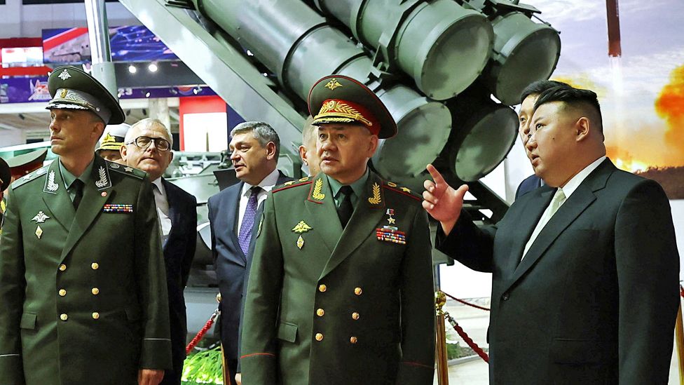 North Korean leader Kim Jong Un and Russia's Defense Minister Sergei Shoigu visit an exhibition of armed equipment on the occasion of the 70th anniversary of the Korean War armistice