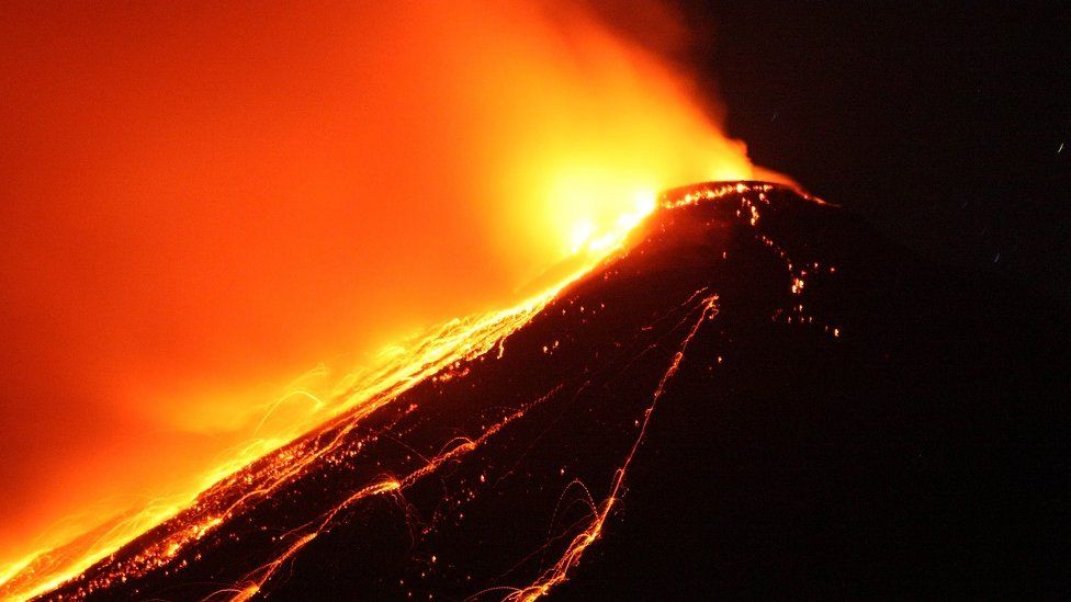 In this picture taken on April 4, 2013, lava spews from the top of Mount Karangetang