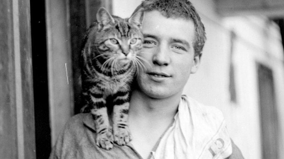Percy Blackborow with a cat on his shoulder