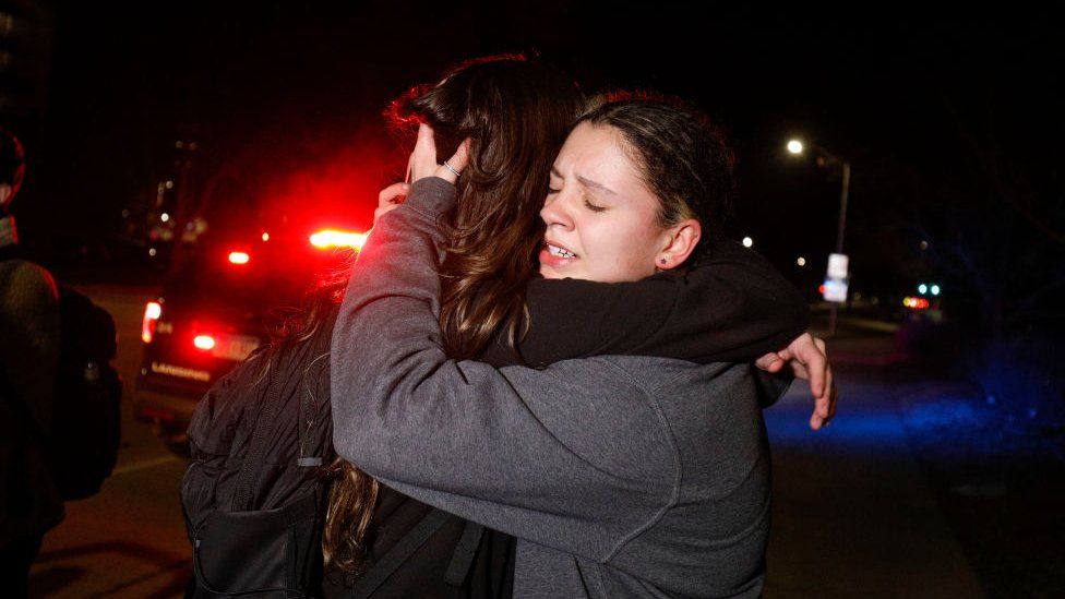 Michigan State University students hug