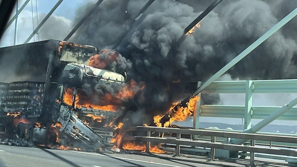 The lorry on fire on the Prince of Wales bridge
