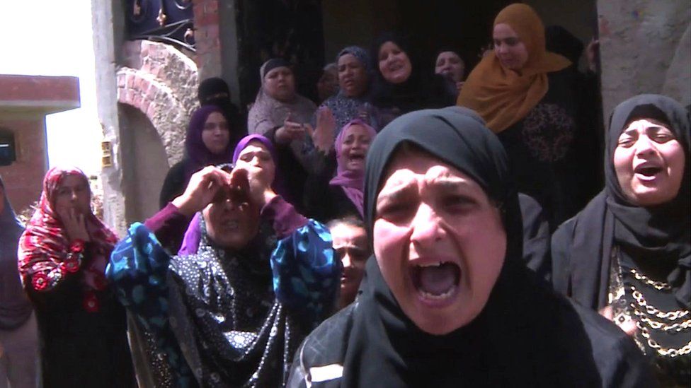 Women in an Egyptian village where many are feared drowned in the Mediterranean