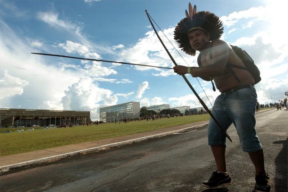 Brazilian indigenous person with a bow during a protest at Explanada dos Ministerios in Brasilia, Brazil, on 25 April 2017.