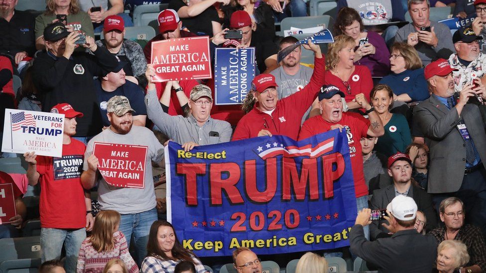 Supporters attend a campaign rally with U.S. President Donald Trump at the Mid-America Center on 9 October 2018 in Council Bluffs. Iowa
