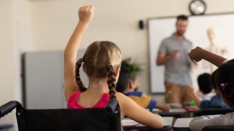 Child with hand up